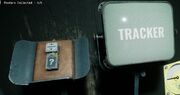 It is a grey remote, with a five light system and two arrows, an antenna, and a panel with a question mark