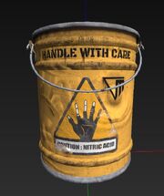 A yellow acid bucket, with the words HANDLE WITH CARE and CAUTION MITHAC (?) ACID, as well as an image of a black hand with the fingers dissolving to show bone and the Murkoff Corp logo.