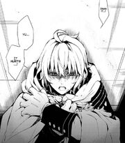 Mika in pain while resisting his thirst for blood.