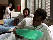 Omar in the hospital ward with Martinez.