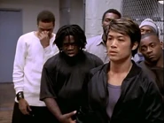 Jia with the Homeboys in the gym as they prepare to attack the Italians and the Latinos.