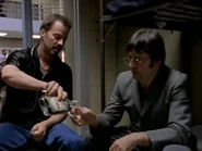 Stanislofsky pouring a shot of vodka for Kosygin.