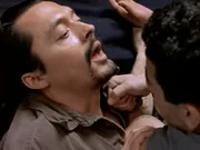  holding a  to Guerra's throat after killing .