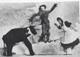 Imogene (Edwin J. Stone) and Dorothy (Anna Laughlin) meet the Scarecrow (Fred A. Stone) 1903