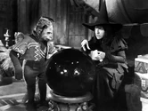 The Wicked Witch of the West with a Flying Monkey. (1939)