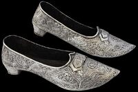Silver Shoes with Pointed Toes: These antique silver shoes are made out of real silver. Their intricate designs indicate their uniqueness and authenticity. Since L. Frank Baum was a collector of antique silver and used silver shoes to parallel the value of silver during the turn of the century, they are most likely the most realistic and closest version to what L. Frank Baum himself possibly envisioned circa 1899-1900 for the original character of Dorothy to wear on her feet during her adventure in the Land of Oz.