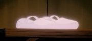Dorothy's magic shoes glow as she is whisked to the Land of Ev in the 1986 anime series.