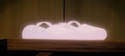 Dorothy's magic shoes glow before she is whisked to Ev in 1986 anime series