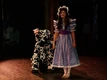 Dorothy (Sheridyn Gasser) and Imogene the cow land in Munchkinland (2010 Revival)