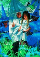 Munchkins watch on as Dorothy is gifted the Silver shoes