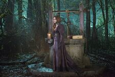 Zelena, at the well, with the Book of Records.