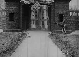 The Gate to the Emerald City, patrolled by the Soldier with the Green Whiskers.