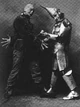 Scarecrow (Fred A. Stone) shaking hands with Niccolo Chopper (David C. Montgomery) 1902
