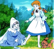 The Good Witch of the North helps Dorothy try on the Silver Shoes.