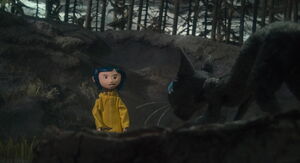 Coraline talking to the cat.