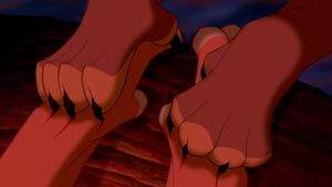 Simba having his paws pierced by Scar's claws.