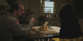 Joyce about to be given Hopper's cigarette.