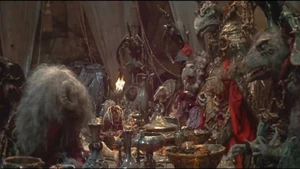 Aughra standing up to the Skeksis