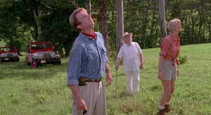 Alan, Ellie, and Hammond looking at the Brachiosaurus.