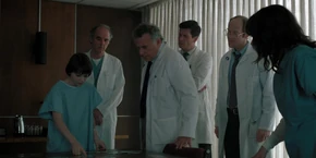 Joyce and Owens seeing Will point to a location.