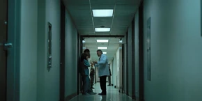 Joyce and Hopper hearing Owens explain that the shadow monster has some sort of hive intelligence.