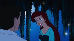 Ariel smiling lovingly at Eric.