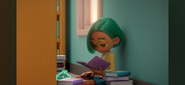 Green Leaf reads a book in the library.