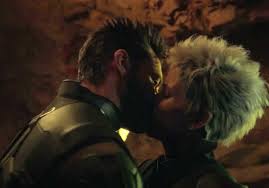 Wolverine and Storm kiss.
