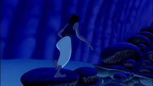 Aladdin crossing an underground lake.