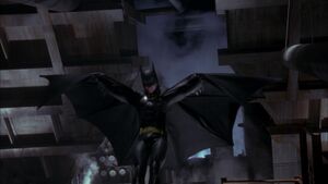 Batman flying to stop Jack Napier from killing Commissioner Gordon.