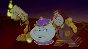 Mrs. Potts, Cogsworth, and Lumière looking down as Beast angrily confronts Belle for refusing to have dinner with him.