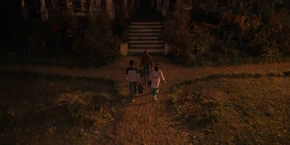Lucas, Max, and Erica walking to enter the Creel house.
