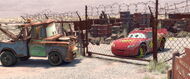 Lightning wakes up in the impound to meet Mater a rusty tow truck.