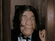 Shemp Howard's ugly face while being pasted on the booth window.