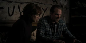 Joyce listening to Hopper reveal that he questioned a man named Earl who said he spotted a kid with a shaved head with a restaurant owner named Benny Hammond before he died.