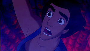 Aladdin horrified when Jafar raises a dagger with the intention of killing him.