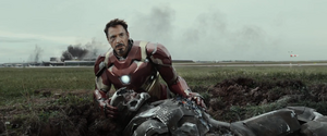 Rhodey unconscious with Iron Man.