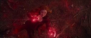 When Thanos orders his ship to fire onto the battlefield, Scarlet Witch uses her powers to protect herself.