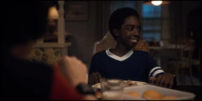 Later, Lucas eats dinner with Mike's family.