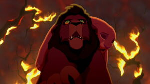 Kovu saving the unconscious Kiara from the fire