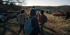 The Party arriving at a junkyard.