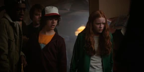 Lucas, Dustin, Jonathan, and Max looking at the demodog.