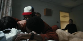 Lucas and Mike embracing and reuniting with Will.