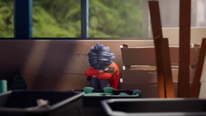 Marc sitting alone in the garden shed
