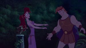 Meg backs into Cupid's arrow.
