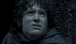 Frodo gets stabbed by the Cave Troll but survives due to his Mithril armor.