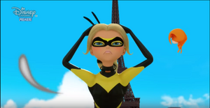 Queen Bee holds the Miraculouses