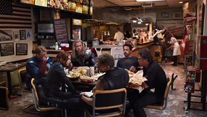 Hawkeye eating Shawarma with the team.