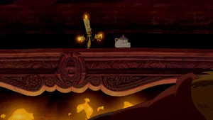 Mrs. Potts and Lumière standing up on the mantle of a fireplace.