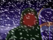 Red Star glowing as he carries an unconscious Starfire out of the blizzard